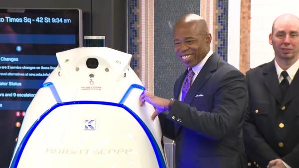 Adams tried to make a hand heart with an NYPD robot, but the robot could not reciprocate because it has no hands.