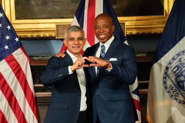 Adams meets with London Mayor Sadiq Khan at City Hall on Wednesday, Sept. 20 - and makes another hand heart.